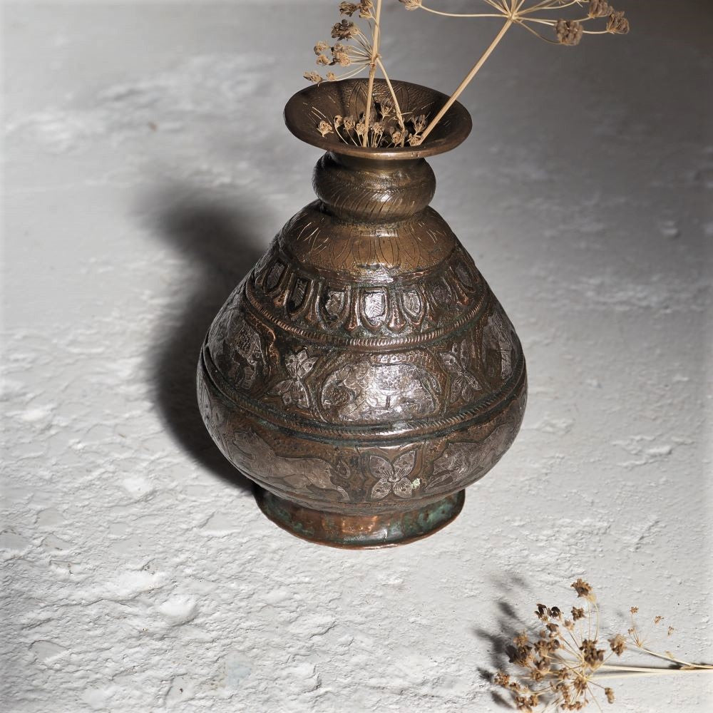 Brass vessel with elephants