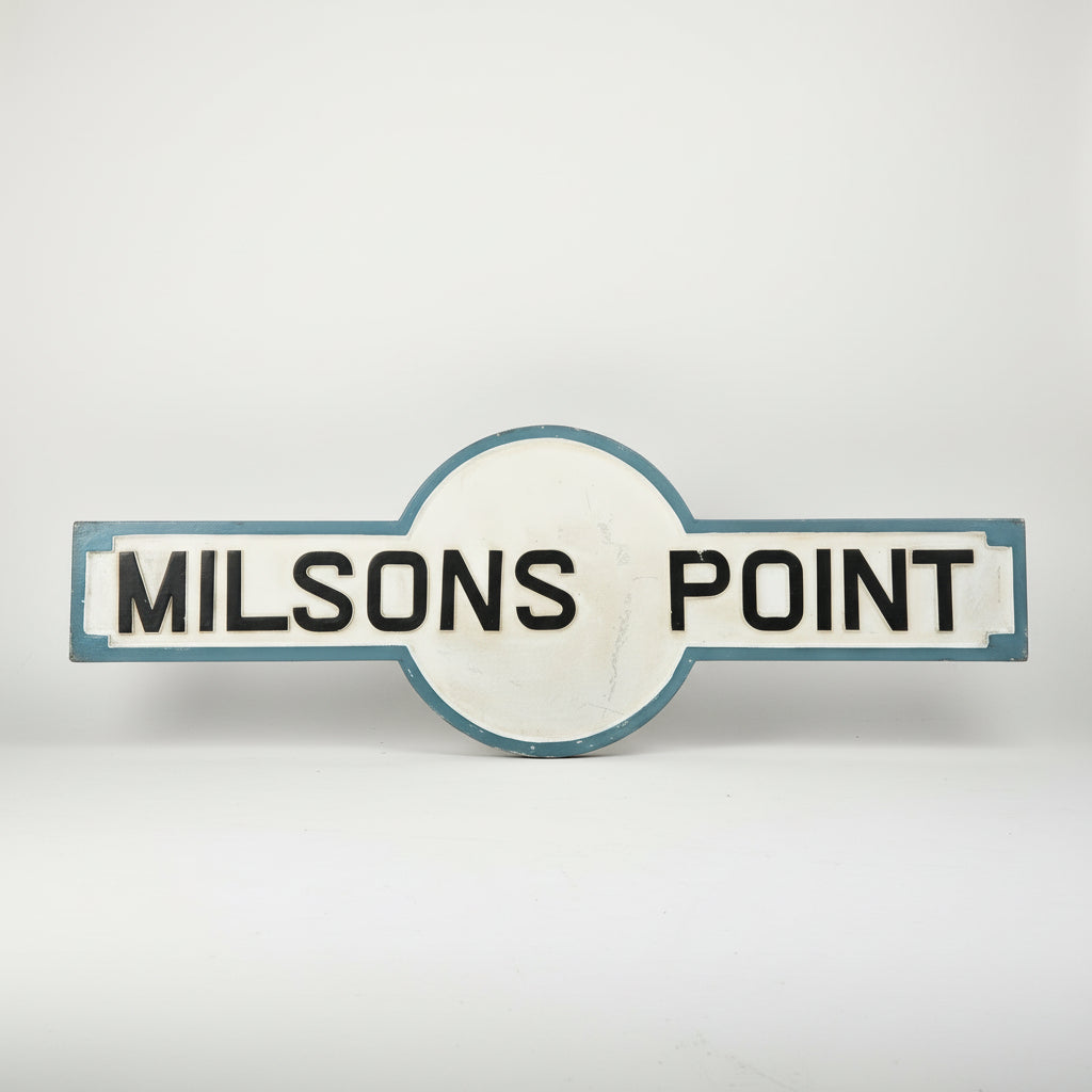 Vintage &#39;MILSONS POINT&#39; sign on a white background