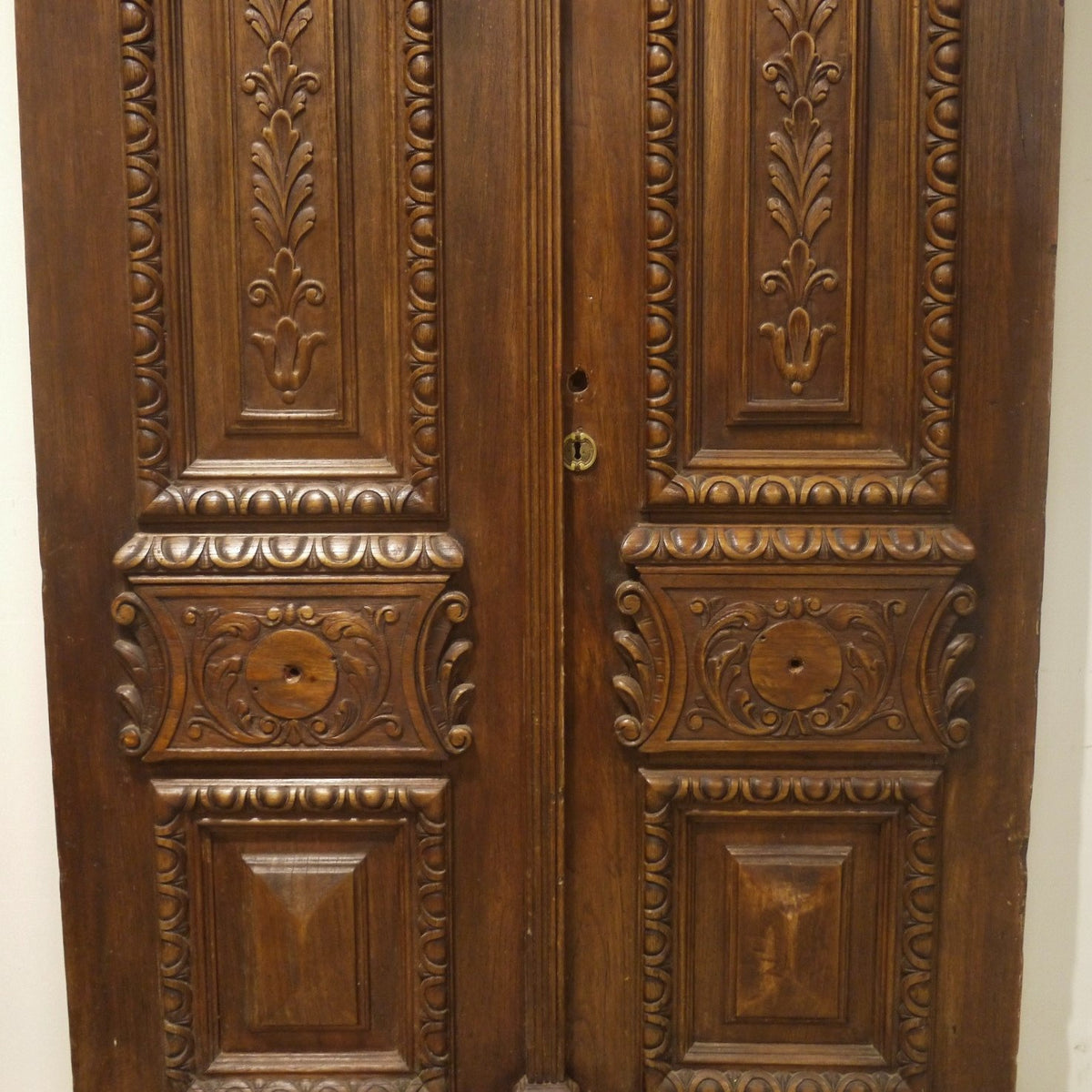 Carved antique entry doors, detail.