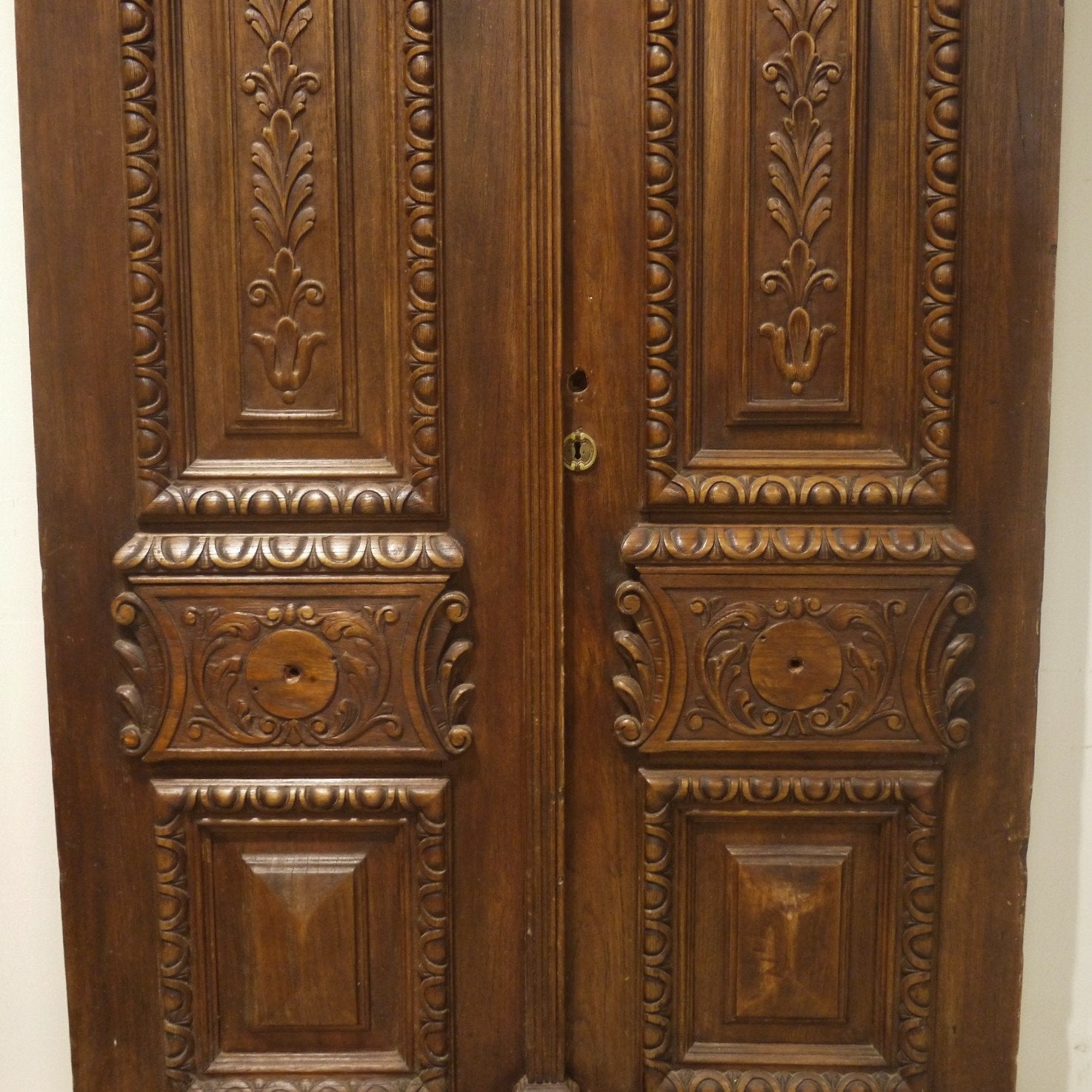 Carved antique entry doors, detail.
