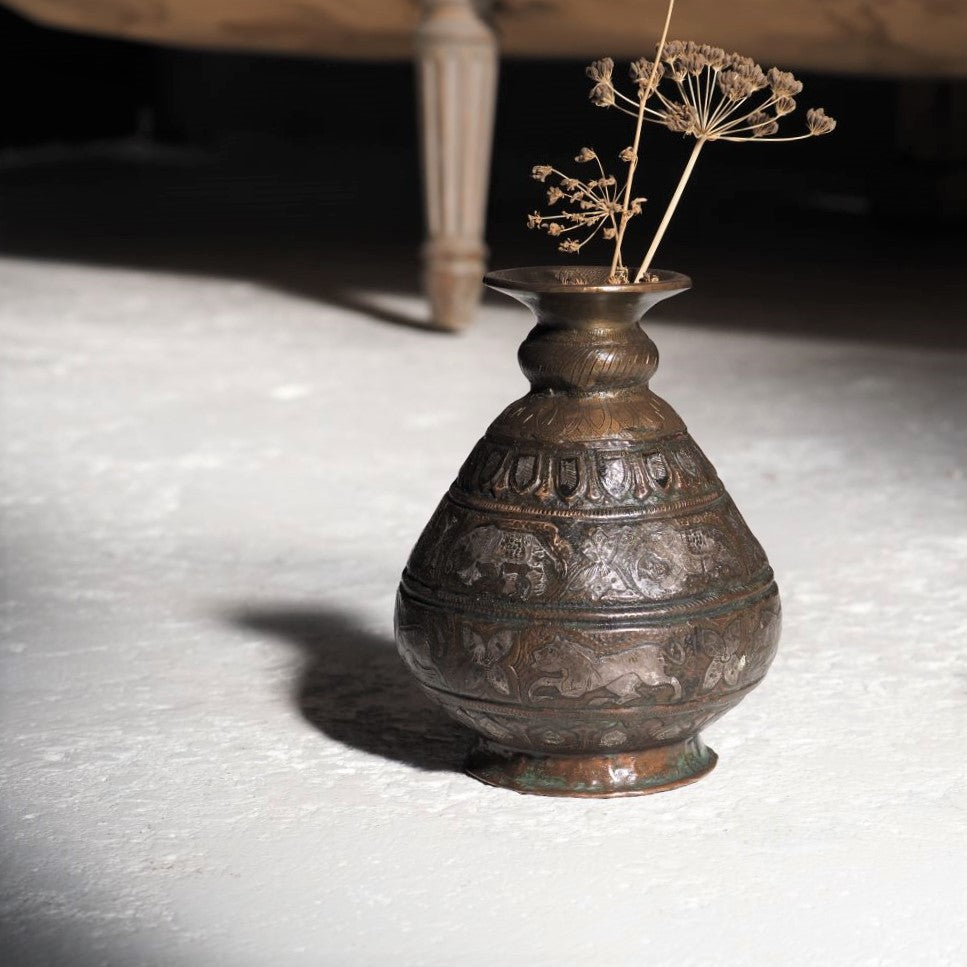 Brass vessel with elephants